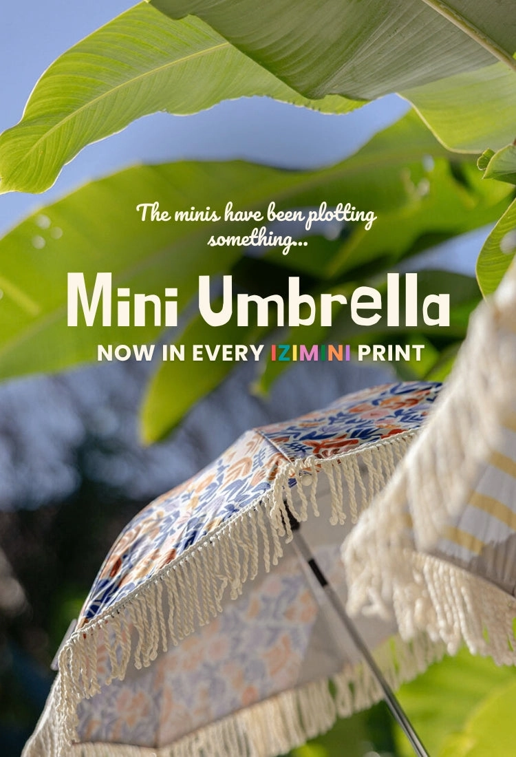 Mini Umbrella campaign poster with a fringed umbrella against the sky