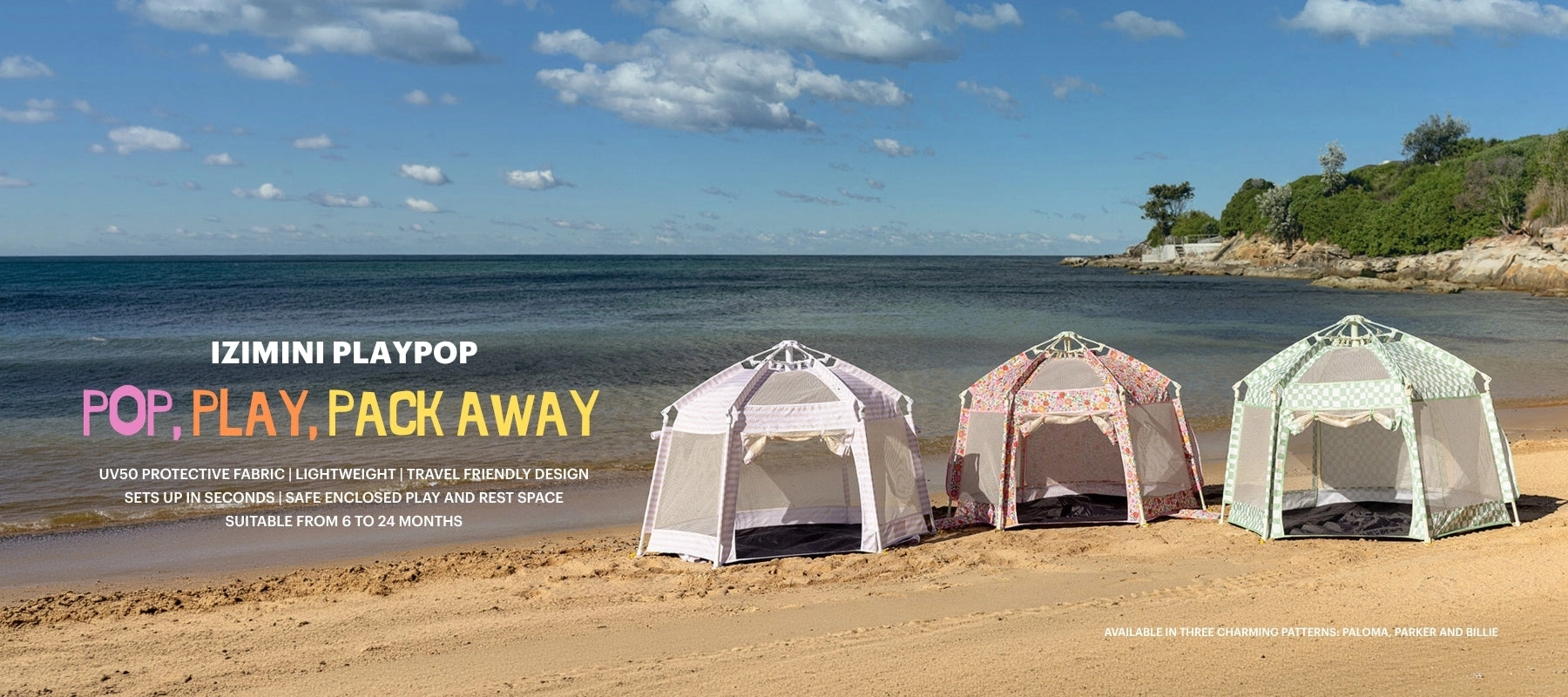 PlayPop tents set up on a sandy beach beside the water